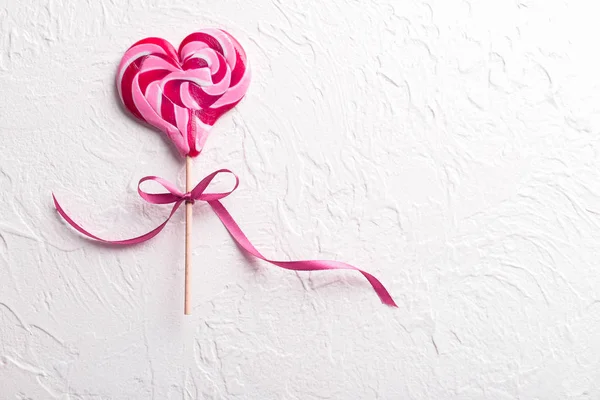 Tasty Heart Shaped Lollipop Light Textured Background — Stock Photo, Image