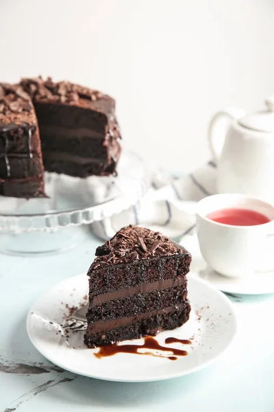 Plate Piece Delicious Chocolate Cake Cup Tea Light Table — Stock Photo, Image