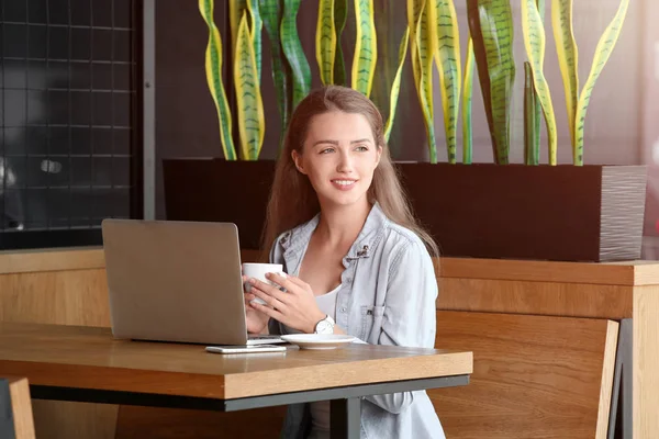 Young Female Freelancer Drinking Coffee While Working Laptop Cafe — Stock Photo, Image