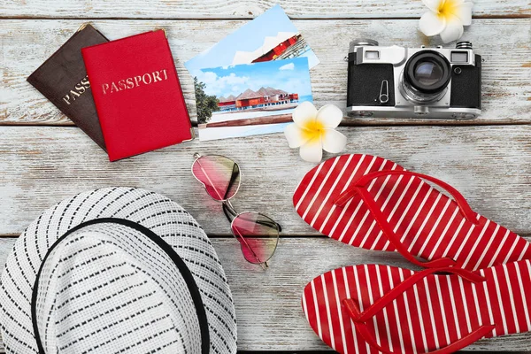 Composition with travel accessories on wooden background