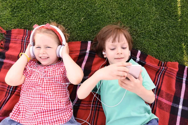 Cute Little Children Listening Music Plaid Outdoors — Stock Photo, Image