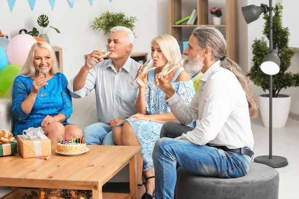 Mature People Celebrating Birthday Champagne Indoors — Stock Photo, Image