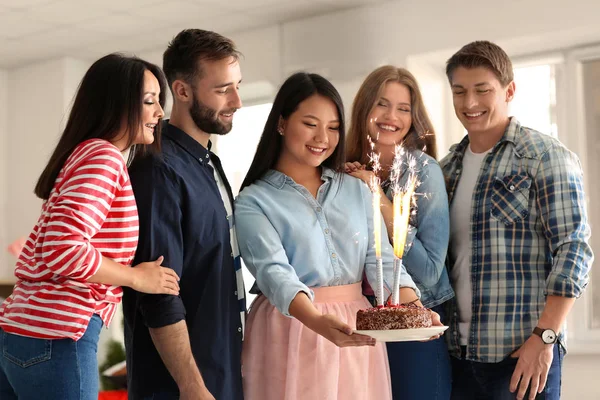 Young Woman Holding Tasty Cake Firework Candles Her Friends Birthday — Stock Photo, Image