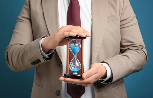 Businessman Holding Hourglass Color Background Time Management Concept — Stock Photo, Image