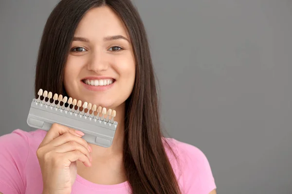 Beautiful Young Woman Teeth Color Samples Grey Background — Stock Photo, Image