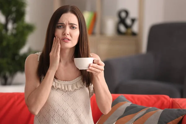 Young Woman Sensitive Teeth Cup Hot Coffee Sofa Home — Stock Photo, Image