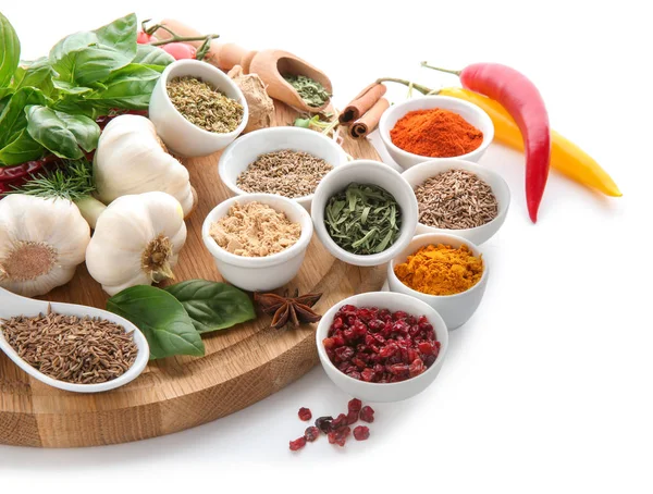 Composition with different spices on white background
