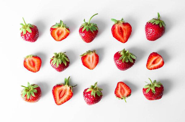 Flat lay composition with ripe strawberries on white background