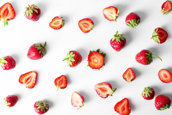 Flat lay composition with ripe strawberries on white background