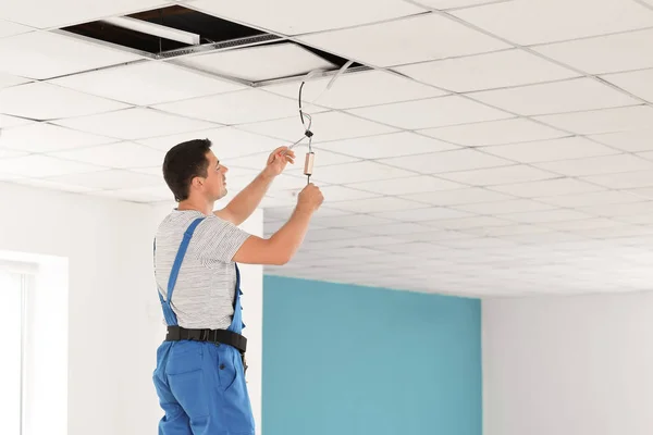 Electrician Measuring Voltage Cable Ceiling Indoors — Stock Photo, Image