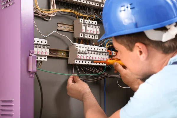 Electrician Repairing Distribution Board Indoors — Stock Photo, Image