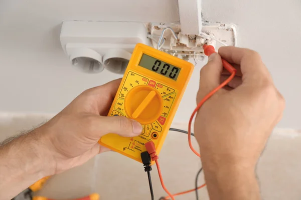 Electrician Measuring Voltage Socket Indoors Closeup — Stock Photo, Image