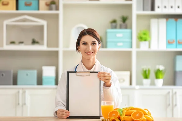 Female Nutritionist Sitting Table Blank Sheet Paper Clipboard Her Office — Stock Photo, Image