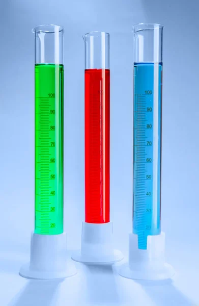 Graduated Cylinders Different Liquids Light Background — Stock Photo, Image