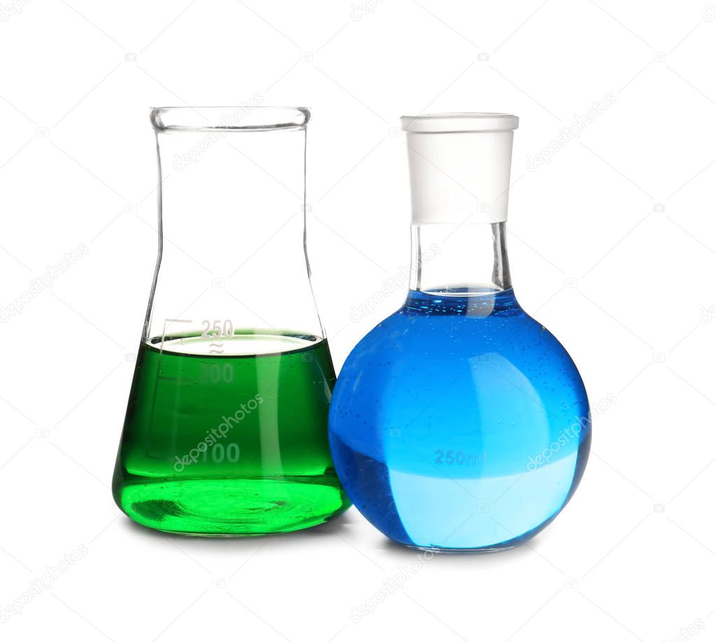 Laboratory glassware with color liquids on white background