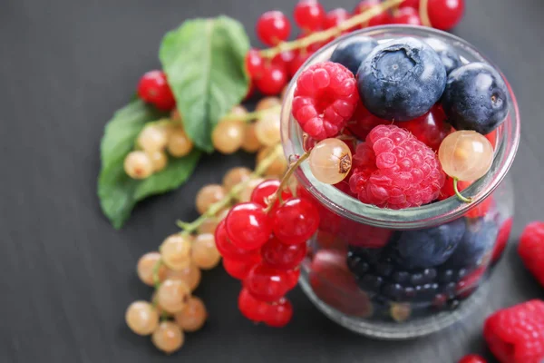 Glass Jar Different Ripe Berries Dark Table — Stock Photo, Image