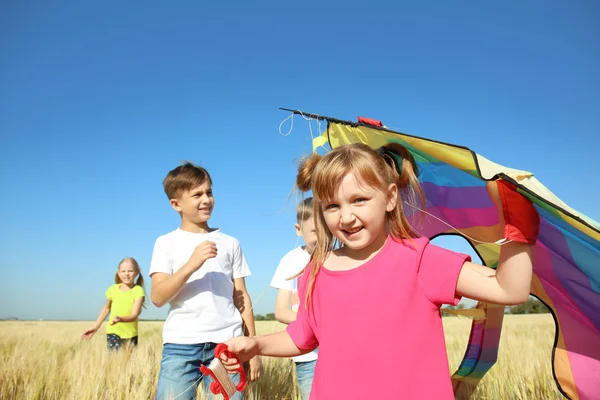 Cute Little Girl Kite Friends Field Sunny Day — Stock Photo, Image