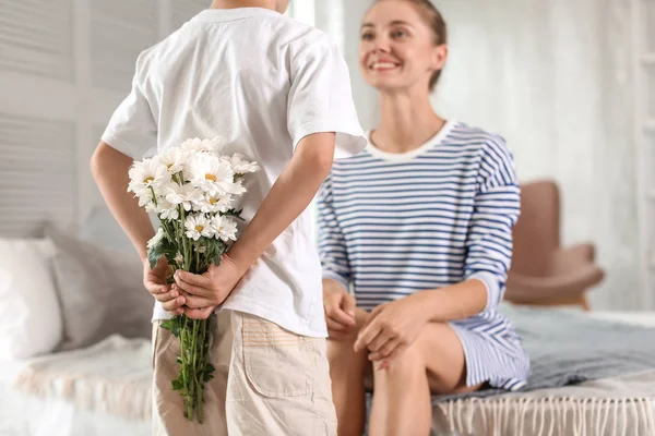 Little Boy Hiding Flowers Mother His Back Indoors — Stock Photo, Image