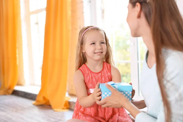 Cute Little Girl Giving Her Mother Gift Box Home — Stock Photo, Image