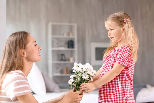 Cute Little Girl Giving Flowers Her Mother Home — Stock Photo, Image