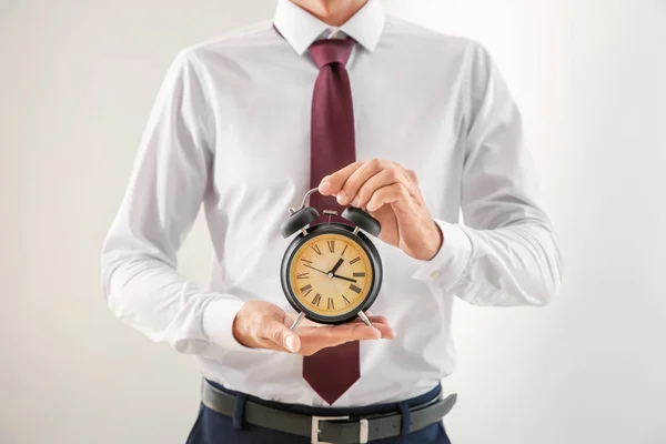 Businessman Holding Alarm Clock Light Background Time Management Concept — Stock Photo, Image