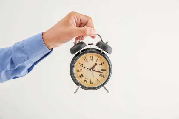 Man Holding Alarm Clock Light Background Time Management Concept — Stock Photo, Image