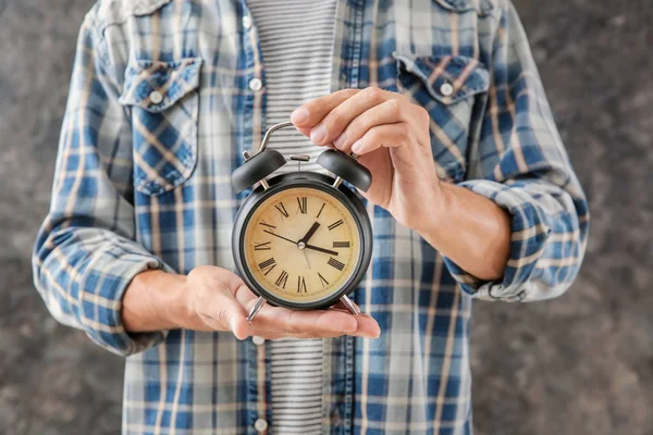 Man Holding Alarm Clock Grey Background Time Management Concept — Stock Photo, Image