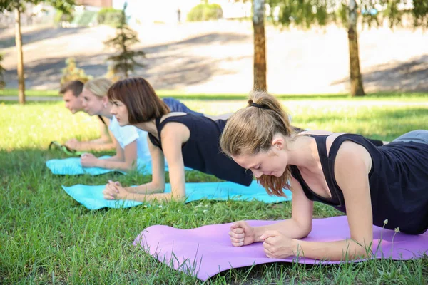 Group Young Sporty People Doing Exercise Outdoors — Stock Photo, Image