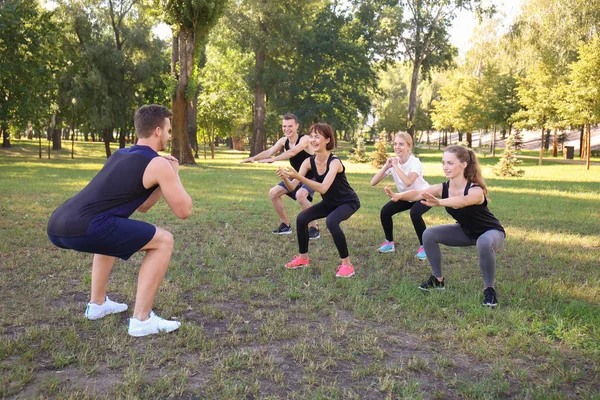 Group Young Sporty People Doing Exercise Outdoors — Stock Photo, Image