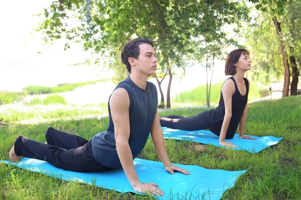 Young Sporty People Doing Exercise Outdoors — Stock Photo, Image