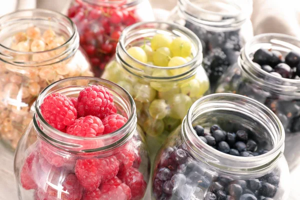 Glass Jars Delicious Ripe Berries Table — Stock Photo, Image