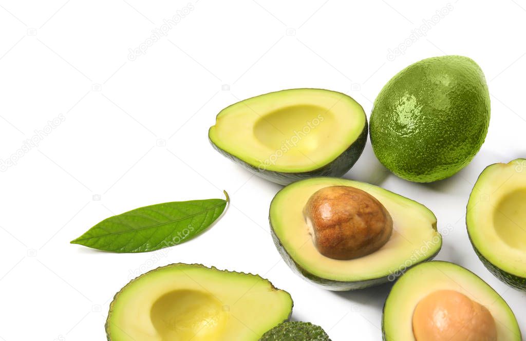 Fresh ripe avocados on white background