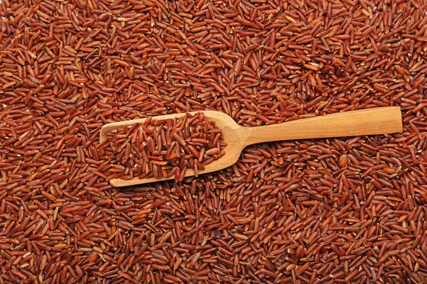 Wooden Scoop Red Rice — Stock Photo, Image