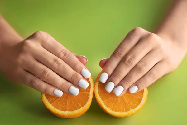 Woman Stylish Nails Holding Halves Orange Color Background Closeup — Stock Photo, Image