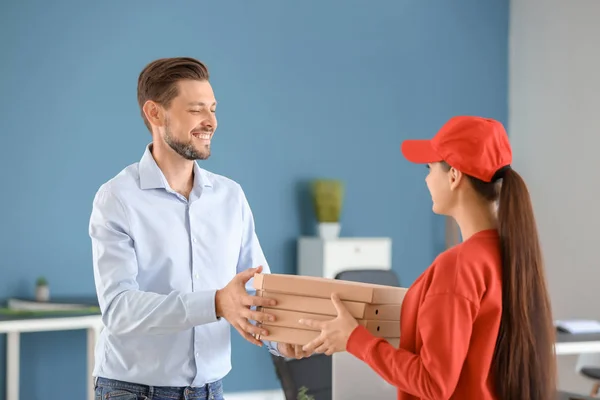 Young Woman Delivering Pizza Customer Indoors — Stock Photo, Image