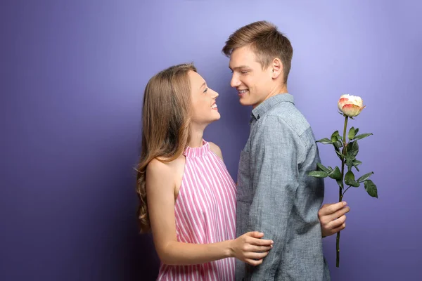 Young Man Hiding Beautiful Flower His Beloved Girlfriend Back Color — Stock Photo, Image