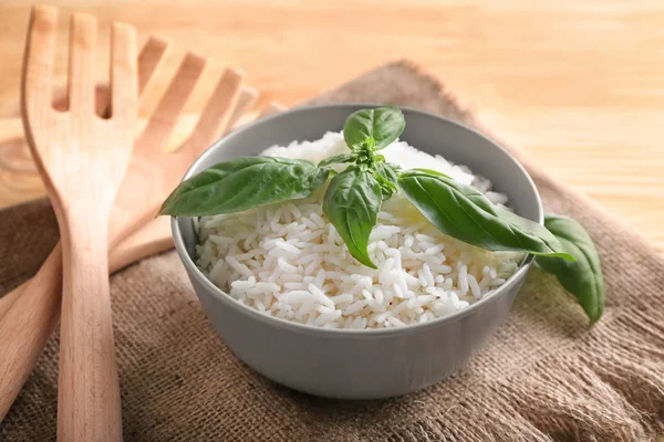 Bowl Boiled White Rice Fresh Basil Leaves Wooden Table — Stock Photo, Image