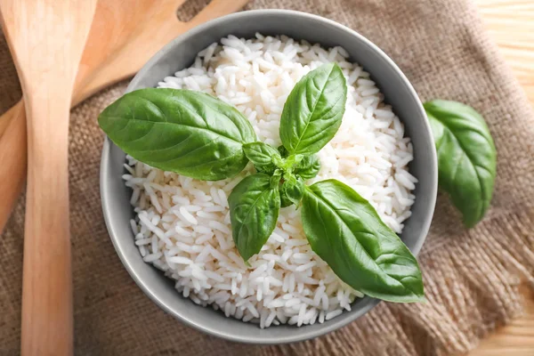 Bowl Boiled White Rice Fresh Basil Leaves Table — Stock Photo, Image