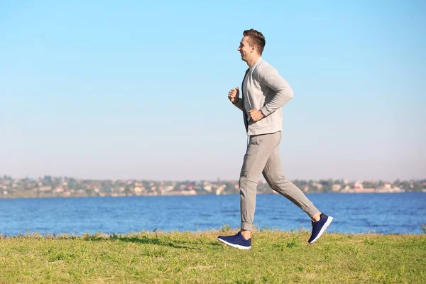 Sporty Young Man Running River Outdoors — Stock Photo, Image