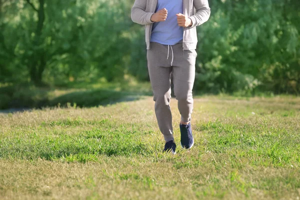 Sporty Young Man Running Outdoors — Stock Photo, Image