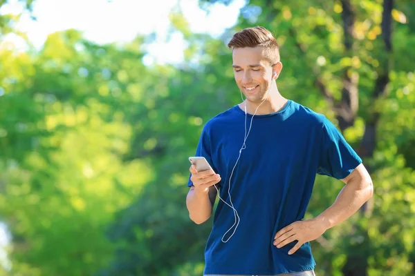 Sporty Young Man Listening Music Outdoors — Stock Photo, Image