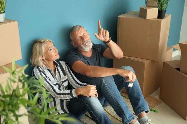 Mature Couple Sitting Floor Boxes Indoors Moving New House — Stock Photo, Image