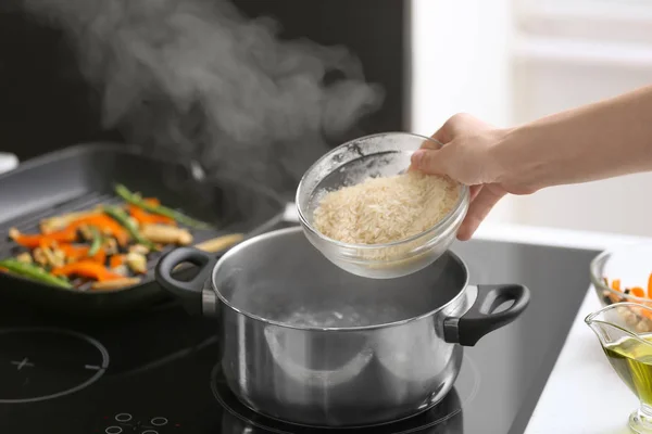 Woman Pouring Rice Saucepan Boiling Water — Stock Photo, Image