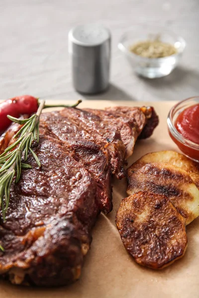 Tasty Grilled Meat Potato Sauce Herbs Parchment Closeup — Stock Photo, Image