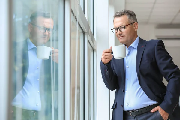 Mature Businessman Drinking Coffee Window Office — Stock Photo, Image