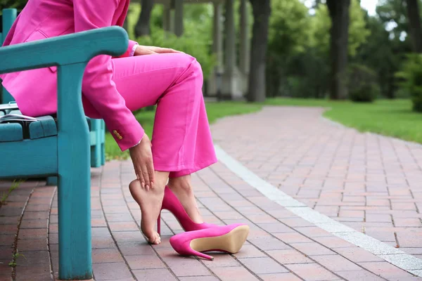 Young Woman Suffering Pain Legs Because Uncomfortable Shoes Outdoors — Stock Photo, Image
