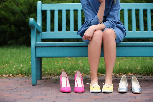 Young Woman Different Pairs Shoes Sitting Bench Outdoors — Stock Photo, Image
