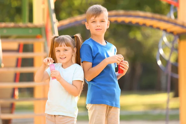 Cute Little Children Blowing Soap Bubbles Outdoors — Stock Photo, Image