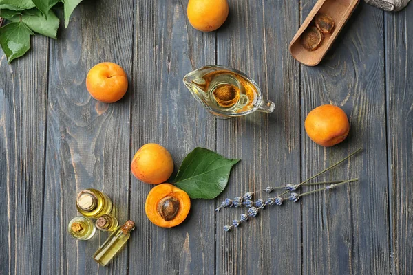 Composition Fresh Apricots Essential Oil Wooden Table — Stock Photo, Image