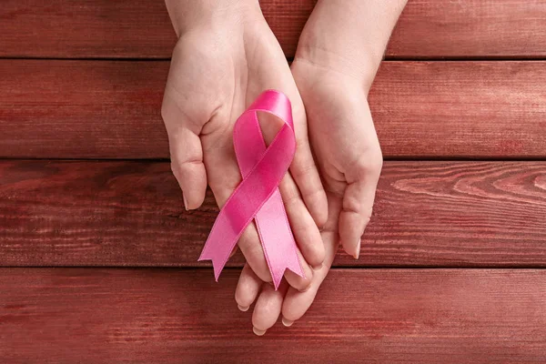 Woman Holding Pink Ribbon Wooden Background Breast Cancer Awareness Concept — Stock Photo, Image